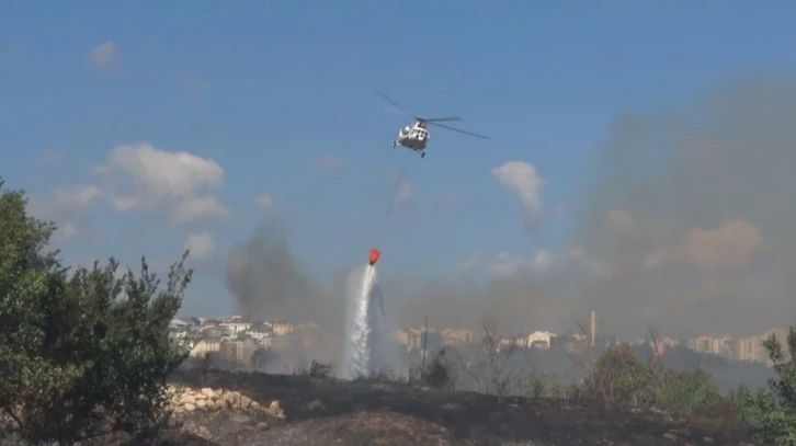 Avcılar’da otluk alanda çıkan yangın helikopter yardımıyla söndürüldü
